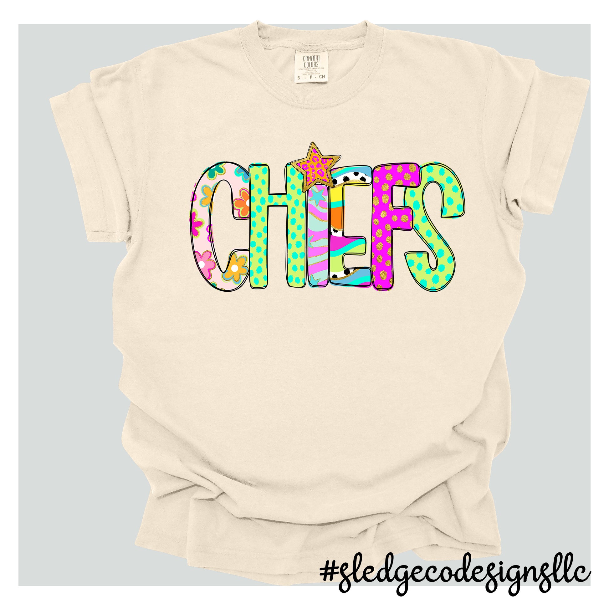 Beige t-shirt with colorful CHIEFS text design on a light gray background